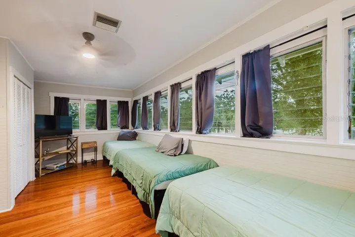Bedroom 3 with lots of natural light and windows. Currently set for a short term rental.