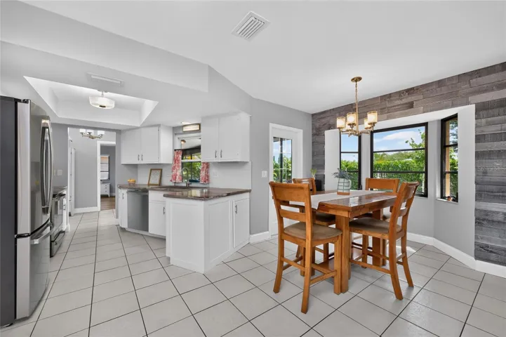 The dinette area is light, bright and has access to the lanai.