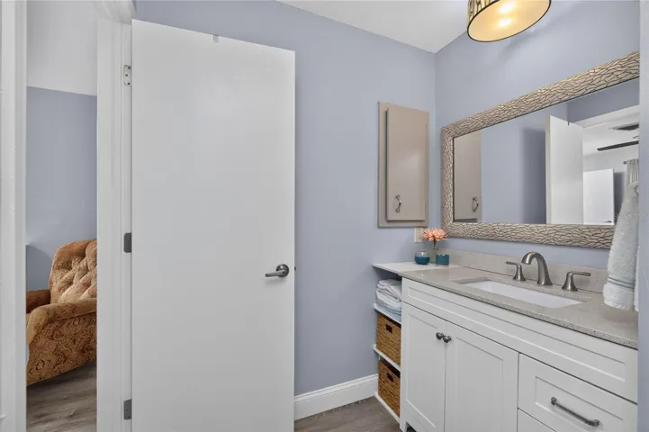 The vanity is quite tasteful in color and style.