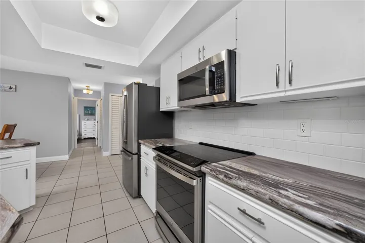 The kitchen is handily located next to the adjoining dinette area.