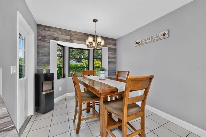 The dinette area features a charming reclaimed wood wall feature!
