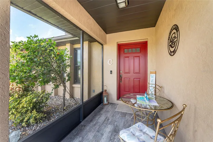 The front entry is screened and has tiled flooring.