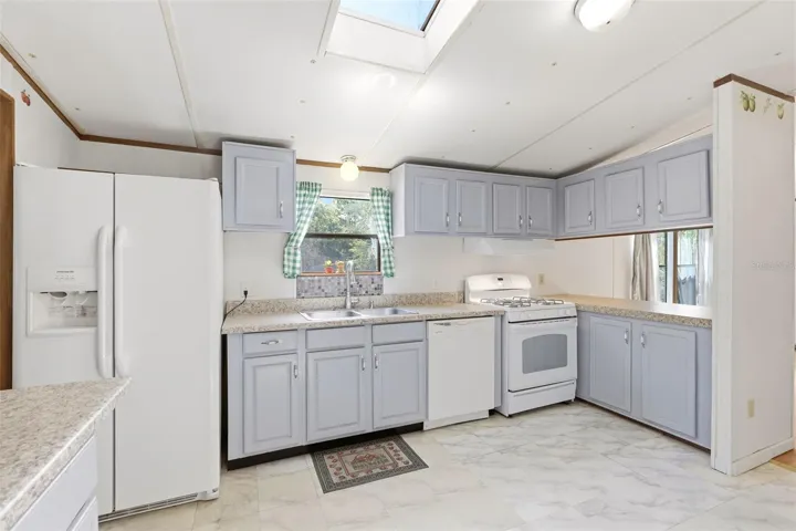 KITCHEN WITH WINDOW AND SKYLIGHT