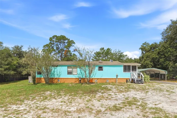 REAR OR HOME WITH CARPORT