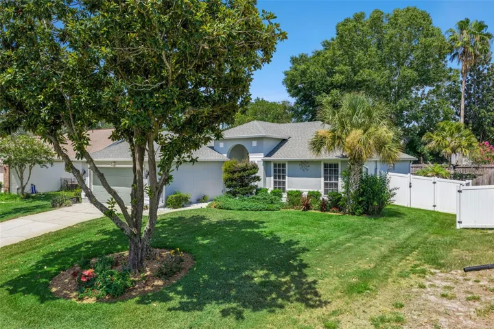 Fenced side yard area offering privacy and additional outdoor functionality.