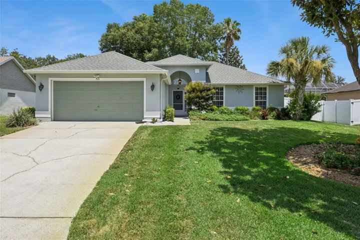 Updated 3 bedroom home in Eustis FL with great curb appeal, mature landscaping, extended driveway, 2 car garage, and quick access to Mount Dora and Highway 441.