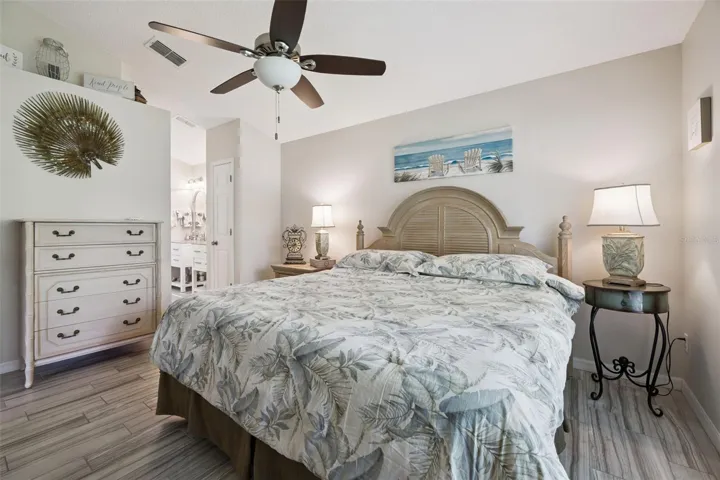 Primary bedroom with direct access to the updated primary bathroom and a functional split-bedroom style layout.