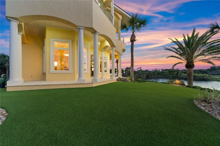 A stretch of emerald lawn meets water, palms, and open sky—creating the perfect backdrop for sunset gatherings, outdoor games, or simply enjoying the peaceful rhythm of life along the course.