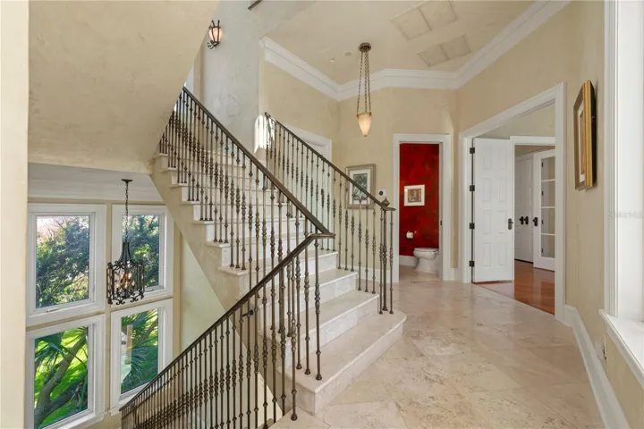 More than a staircase, this graceful architectural feature serves as the home's spine, seamlessly linking each floor while making every arrival feel special