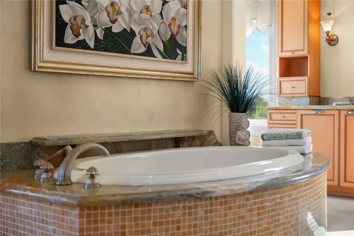 Pour a glass of wine, settle in, and let the day melt away in the comfort of this elegant soaking tub.