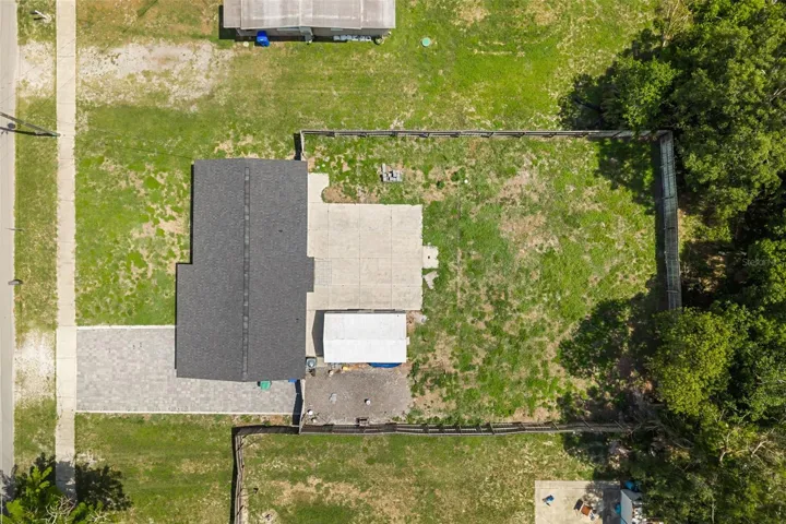Nice expansive lot with fully fenced in back yard, oversized back yard patio perfect for entertaining, and storage shed/workshop.