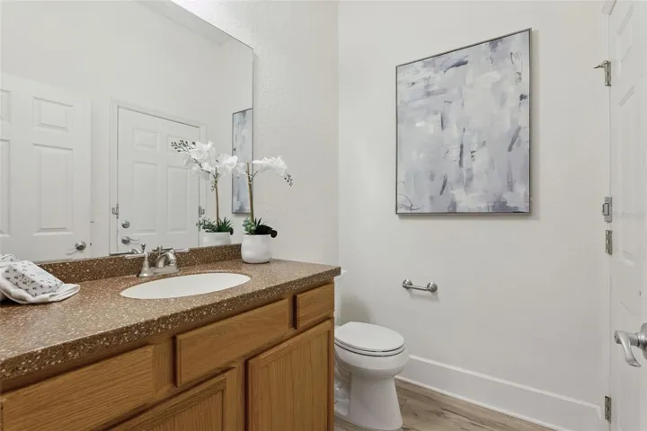 Guest Half Bath tucked away off Family Room