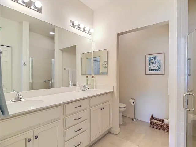 Primary Bathroom Dual Sinks and Tall Vanities