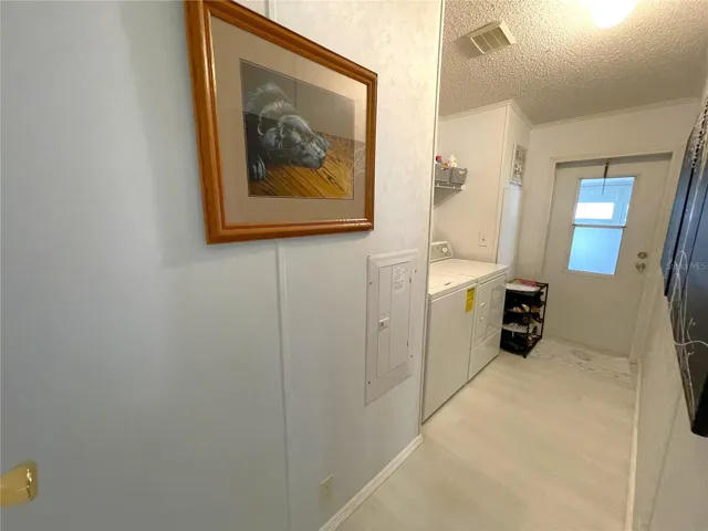 Spacious Laundry room leads to lanai and carport