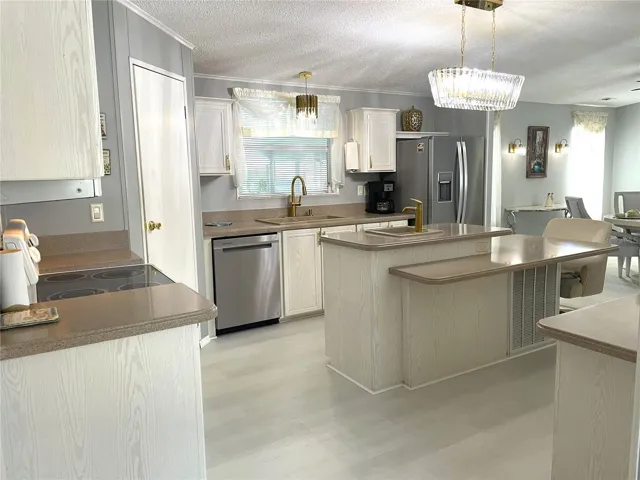 Newer stainless appliances, flooring, lighting and plumbing fixtures