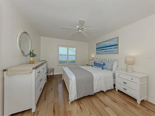 The second bedroom and third bedrooms are located on the other side away from the primary and near the second full bath. This area includes a pocketing door to make this area private for guests or a blended family.