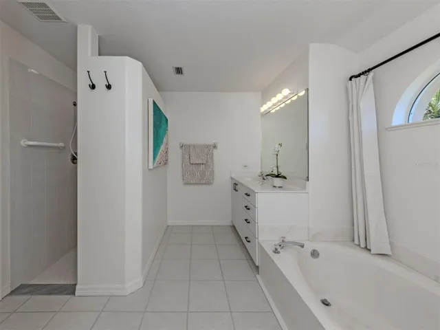 The primary suite also includes a large walk in shower!
