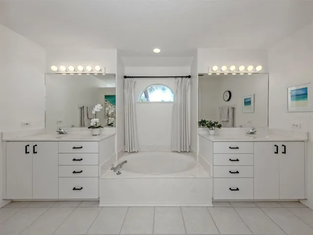 The primary bath room includes dual sinks, garden tub, and private water closet