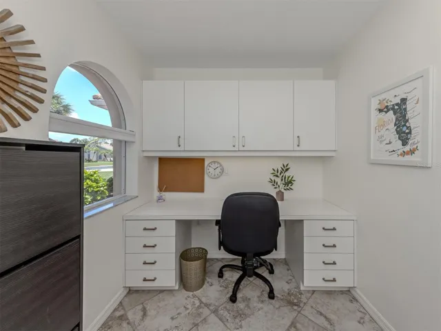The built-in desk located in the laundry room can double as extra storage or the perfect office or study space.