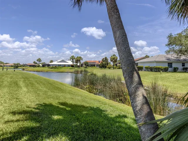 The rear of this property offers extra green space and water views. The fountain for the pond runs in the mornings and evenings make this so tranquil and peaceful.