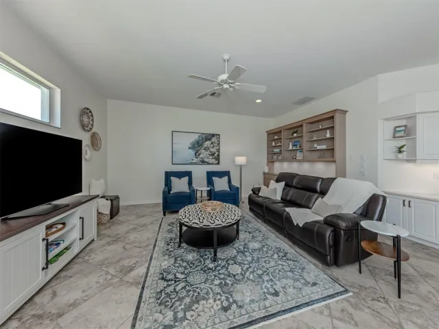 This very inviting space is the perfect place to unwind and enjoy a movie night after a day at the beach or a day at the club