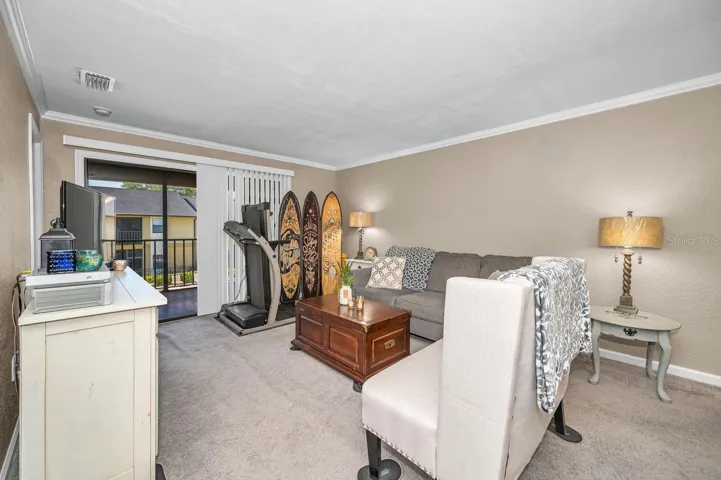 Spacious living area with view of the pool
