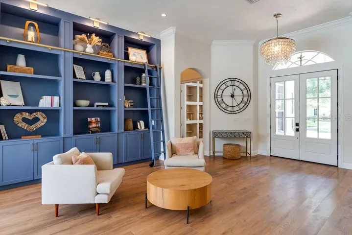 Family Room with built in library, complete with functional rolling ladder