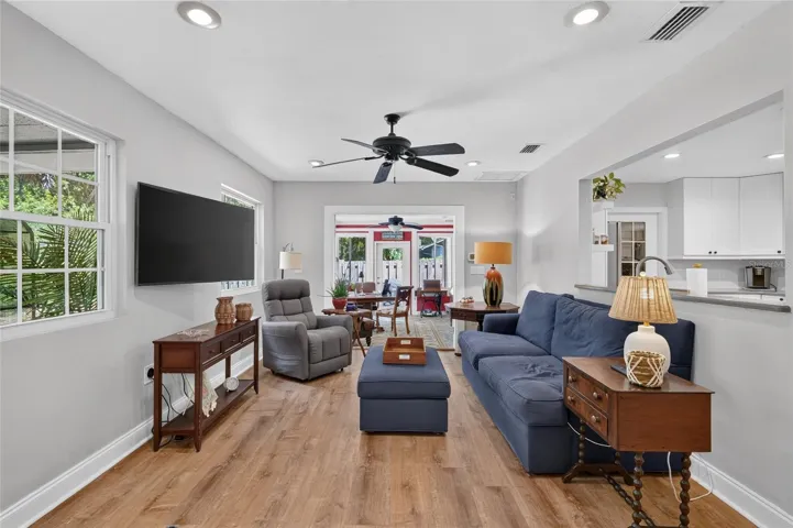 FAMILY ROOM OPENS TO FLORIDA ROOM BEYOND