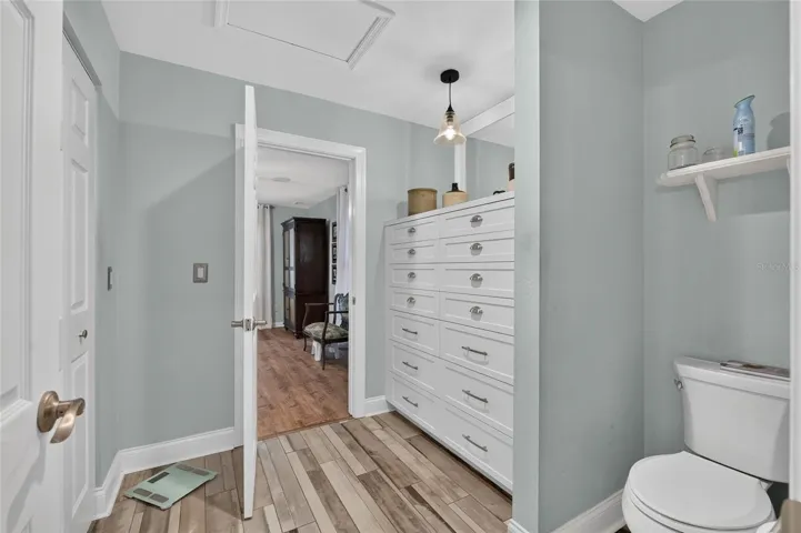 BUILT-INS AND WALK-IN CLOSET IN DRESSING AREA OF PRIMARY BATH