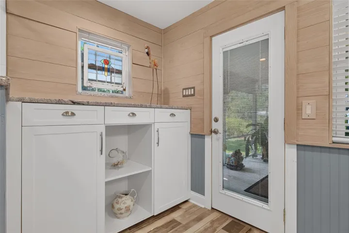 PLENTY OF STORAGE IN PRIMARY BATH, DOOR TO SCREEN PORCH