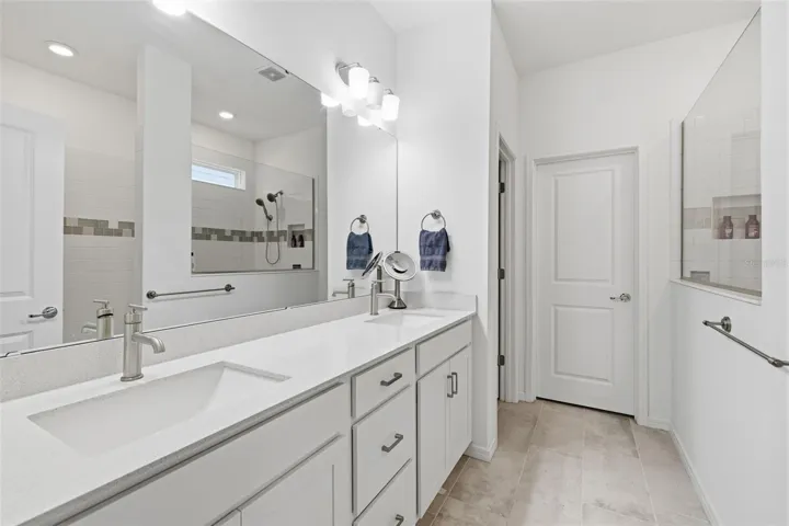 Primary bathroom with double sink Quartz vanity, walk-shower, water closet