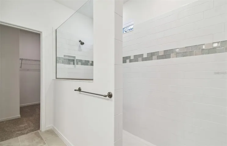 Primary shower with huge walk-in closet