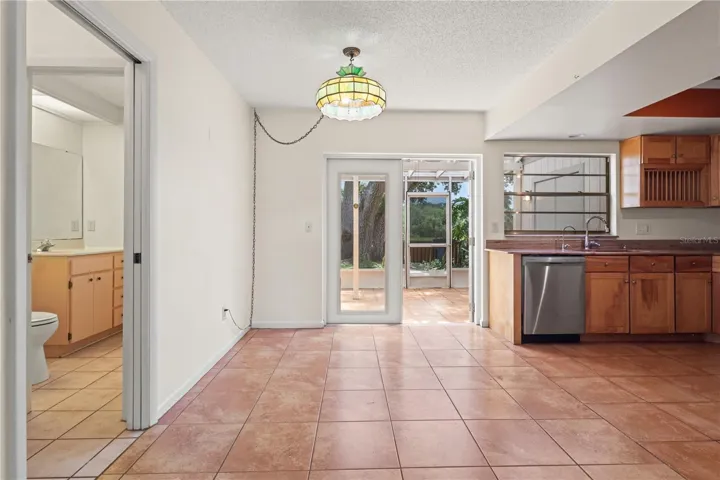 Dining area off the kitchen with bathroom to the left