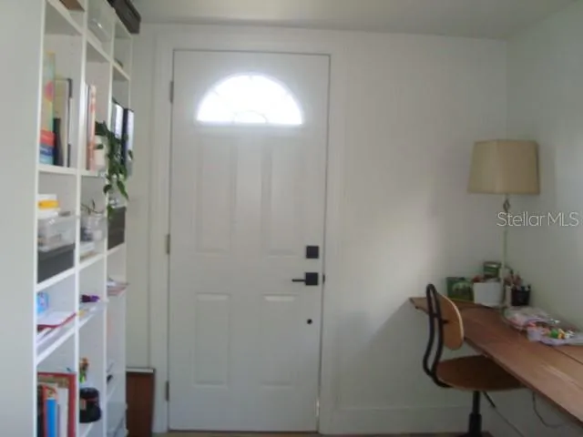 The front entrance has a walk in room that can be used as an office or study area.