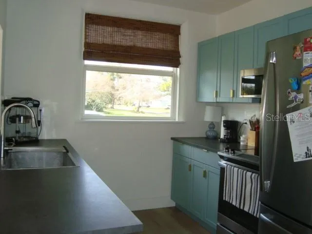 The kitchen has stainless steel appliances and has been updated