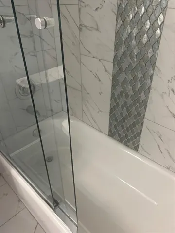Tiled Shower with Glass Shower Doors