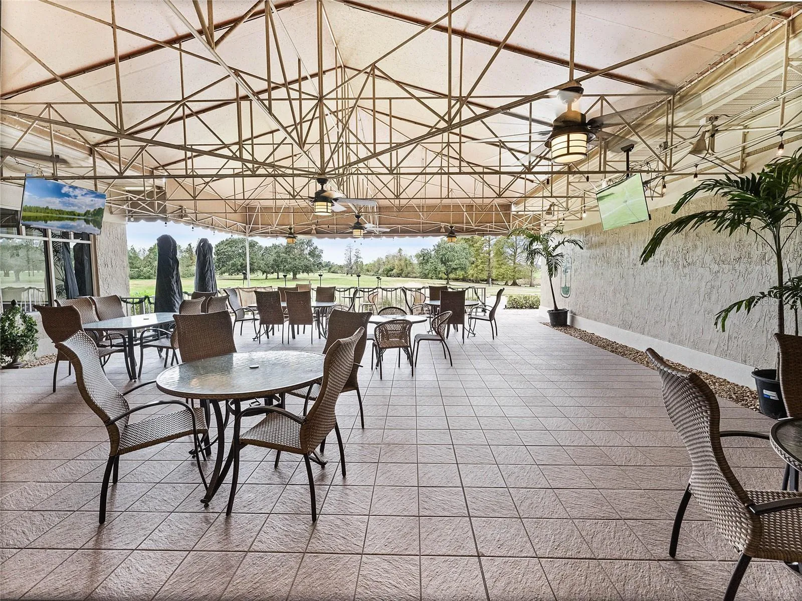 Clubhouse features a Restaurant &amp; patio with distant Golf Course Views