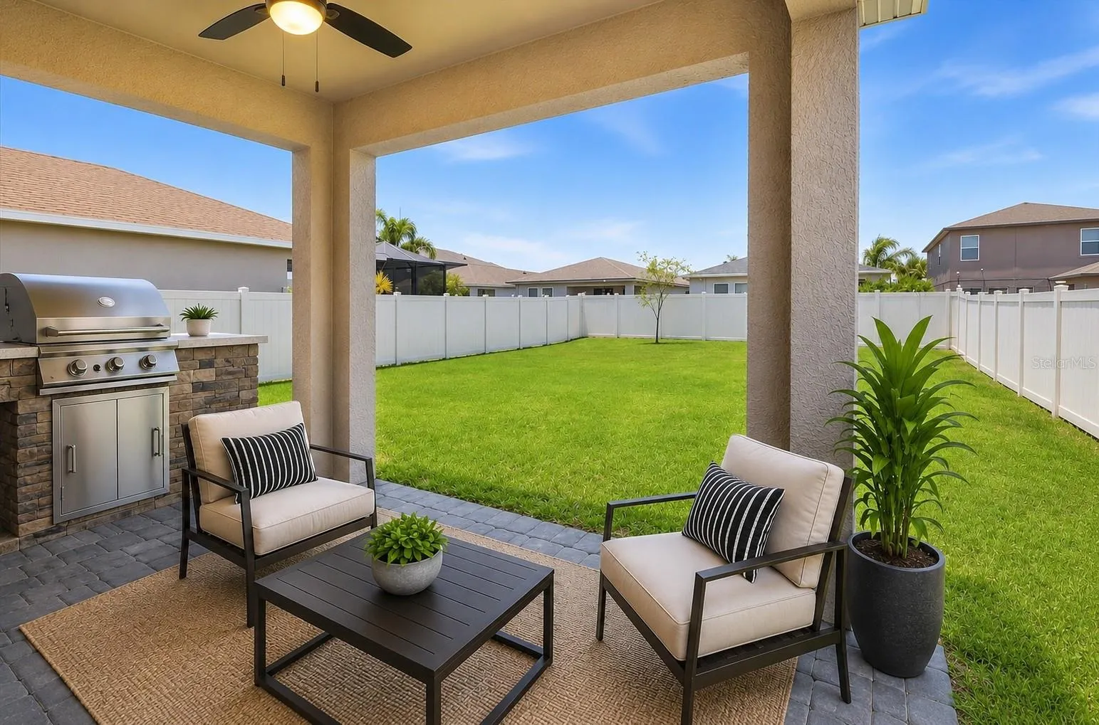 Virtual Staging- Back Covered, Pavered Patio w/ fan