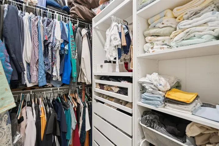 Primary Walk-In Closet with Custom Built-Ins