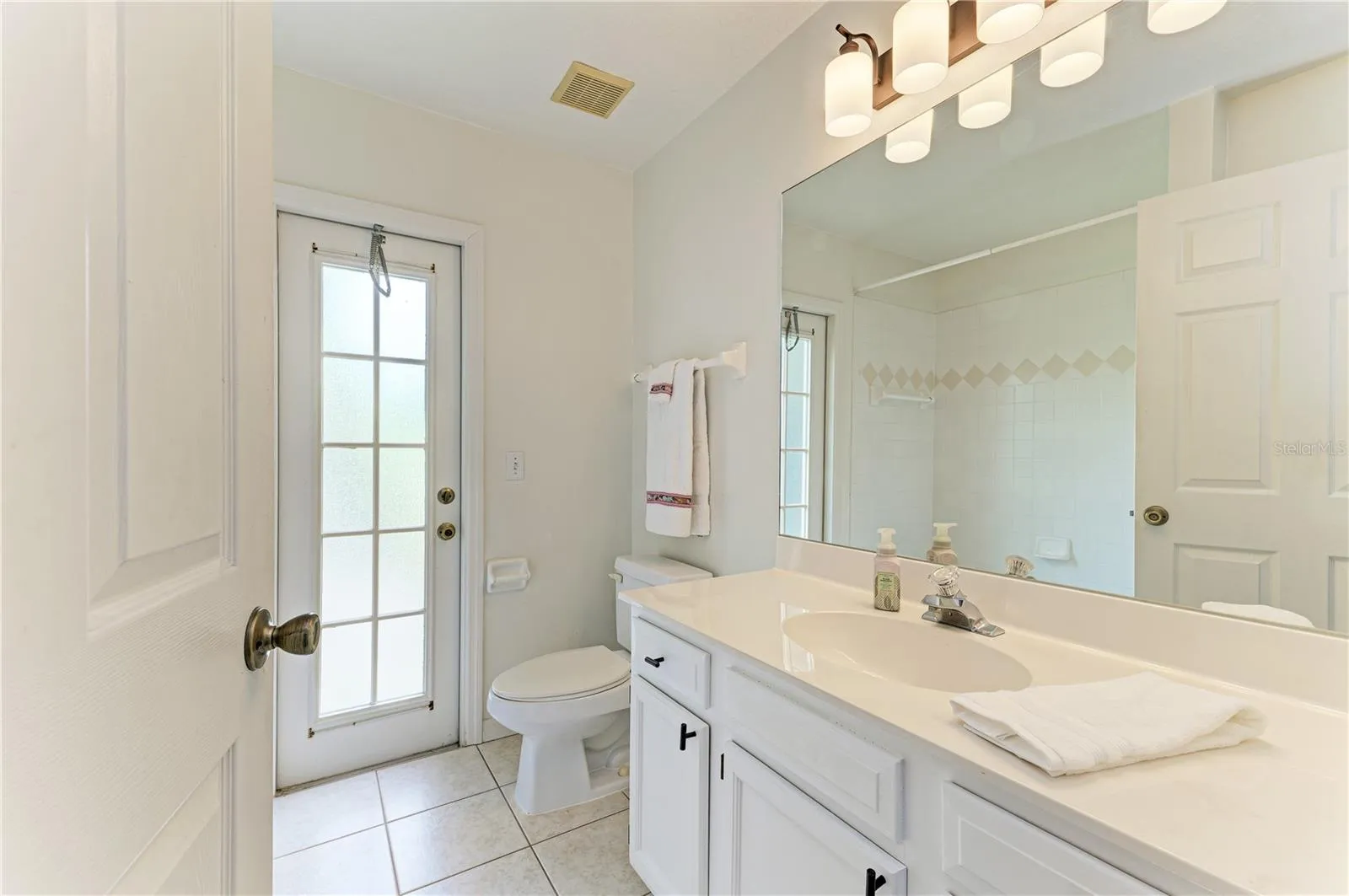 Bathroom 2 with vanity, linen closet and tub/shower combo