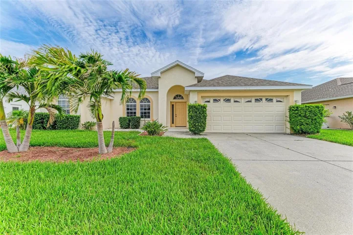 Exterior front elevation with tropical landscaping