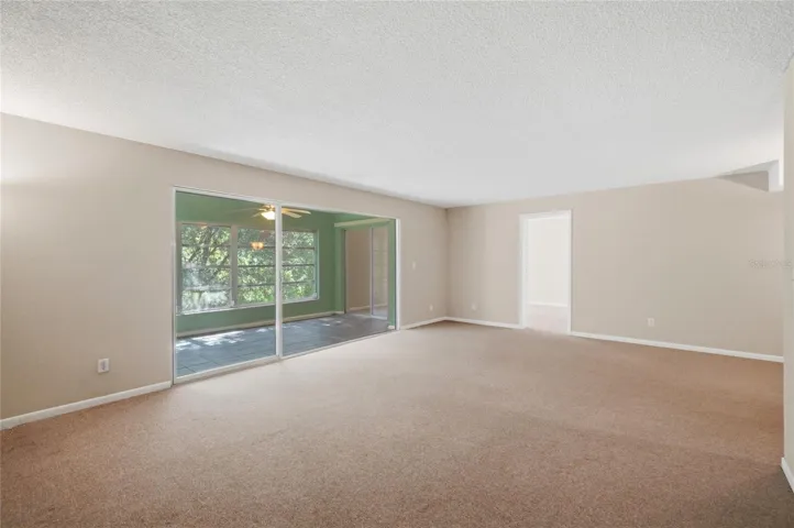 LIVING ROOM/SUNROOM/PRIMARY BEDROOM
