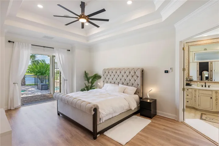 Primary Suite opens to cobblestone pool patio