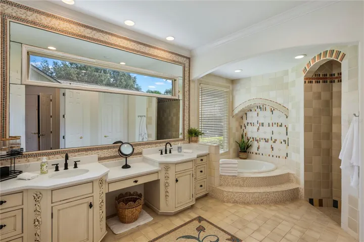 Custom tile work in the Primary Bath is a work of art!