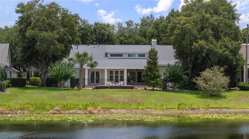 Flanked by mature oak trees, house stays cool in the shade