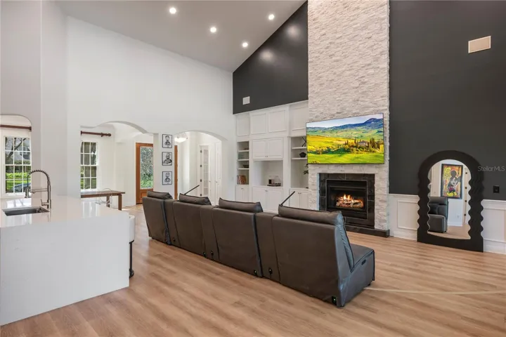Gorgeous stacked stone fireplace and kitchen exhaust hood