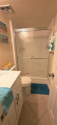 hall bathroom just outside second bedroom and kitchen area