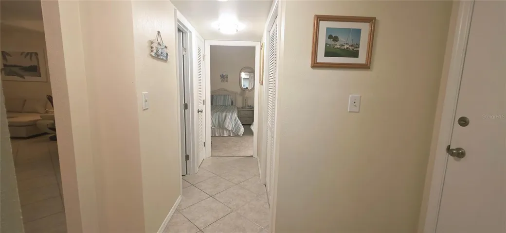 Hallway looking towards 2nd bedroom and hall bathroom. Entry door to the right