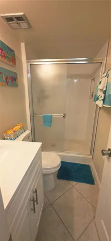hall bathroom just outside second bedroom and kitchen area