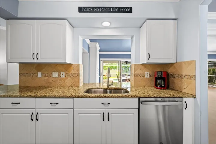 Kitchen has a convenient passthrough serving window
